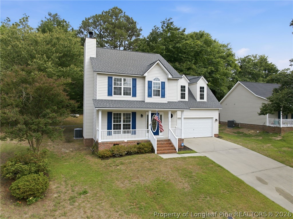 5113 Archer Road Hope Mills, NC 28348 - Photo 3 of 41 a view of a house with a yard and potted plants