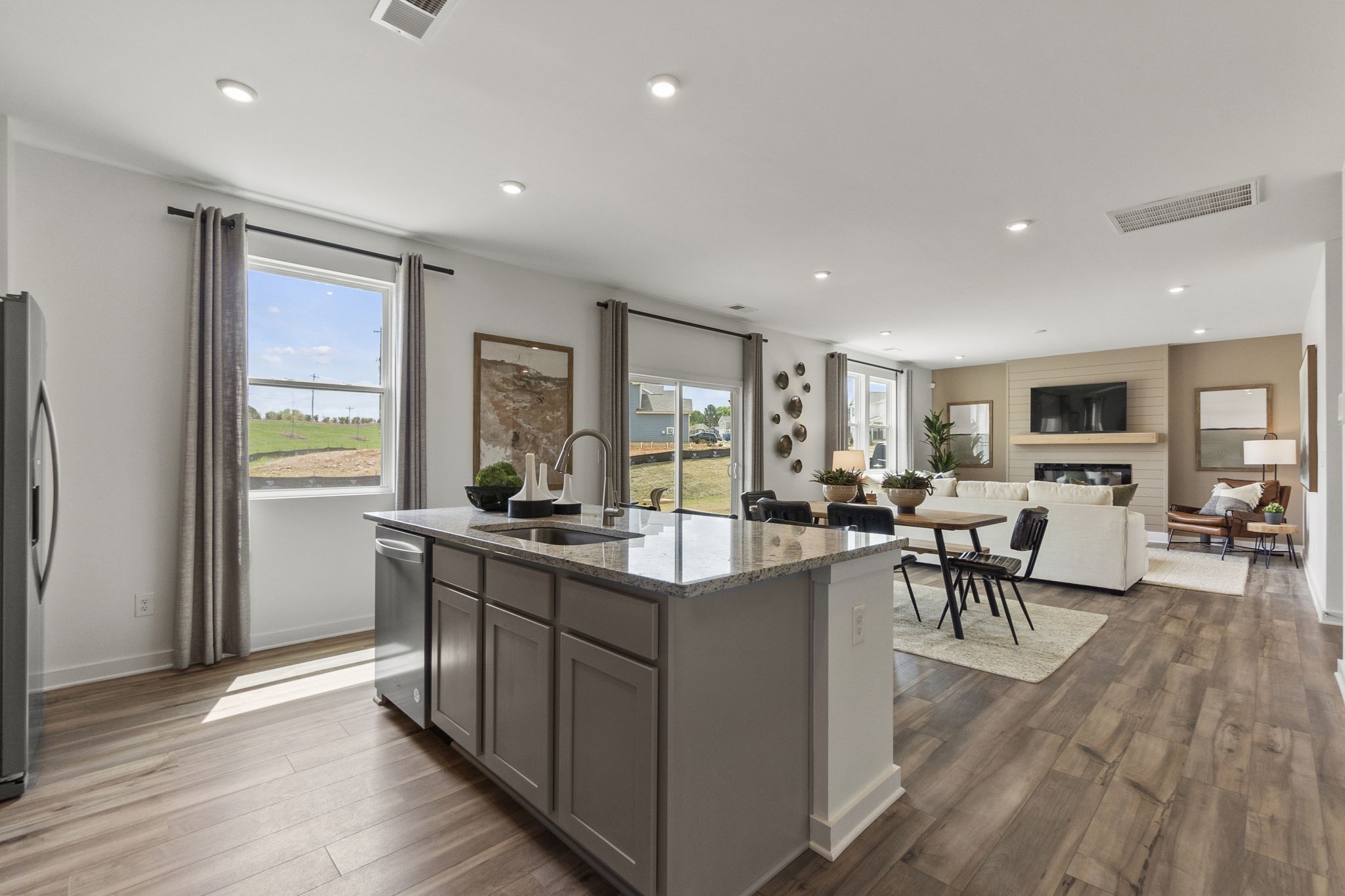 263 West Millbrook Drive Spring Hill, TN 37174 - Photo 17 of 31 a living room with stainless steel appliances granite countertop furniture wooden floor and a view of kitchen
