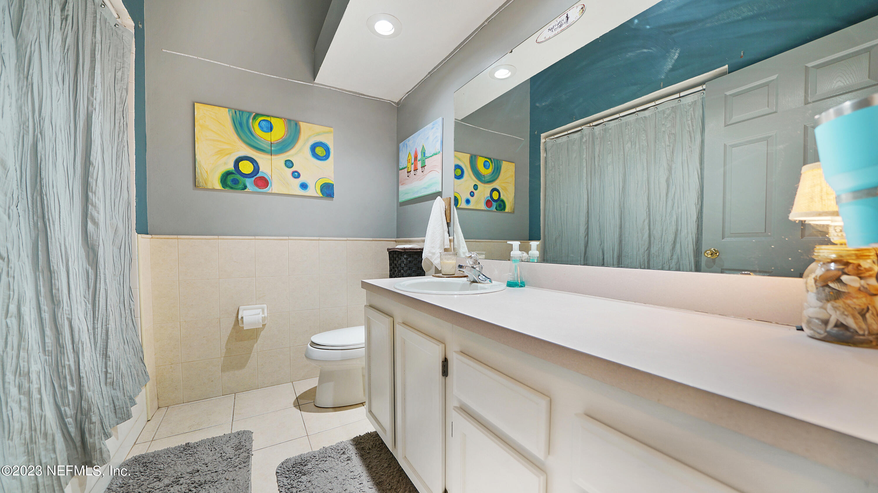 644 Hummingbird Court St. Johns, FL 32259 - Photo 12 of 36 a bathroom with a sink a toilet and painting on the wall