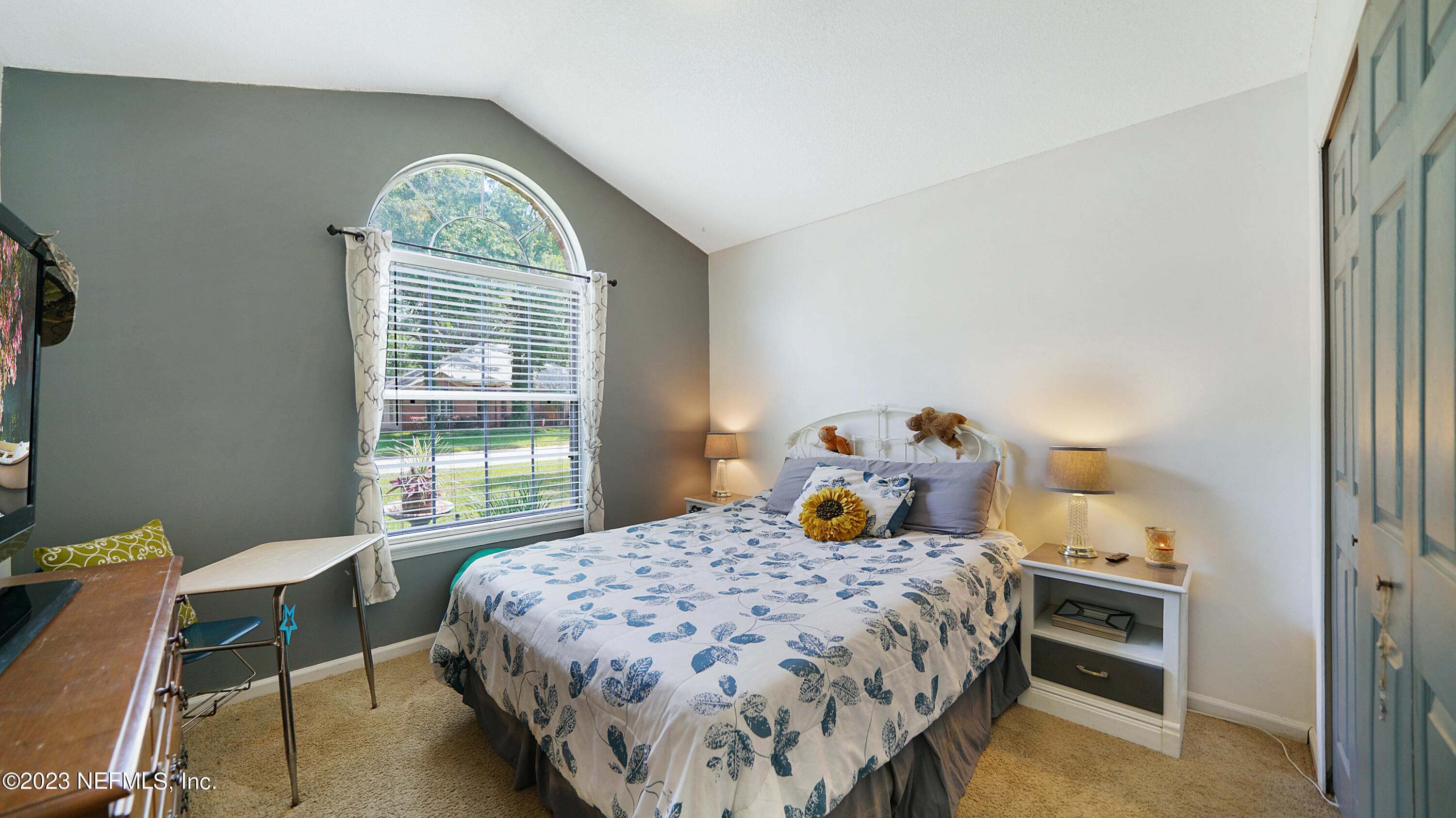 644 Hummingbird Court St. Johns, FL 32259 - Photo 13 of 36 a bedroom with a bed and a table