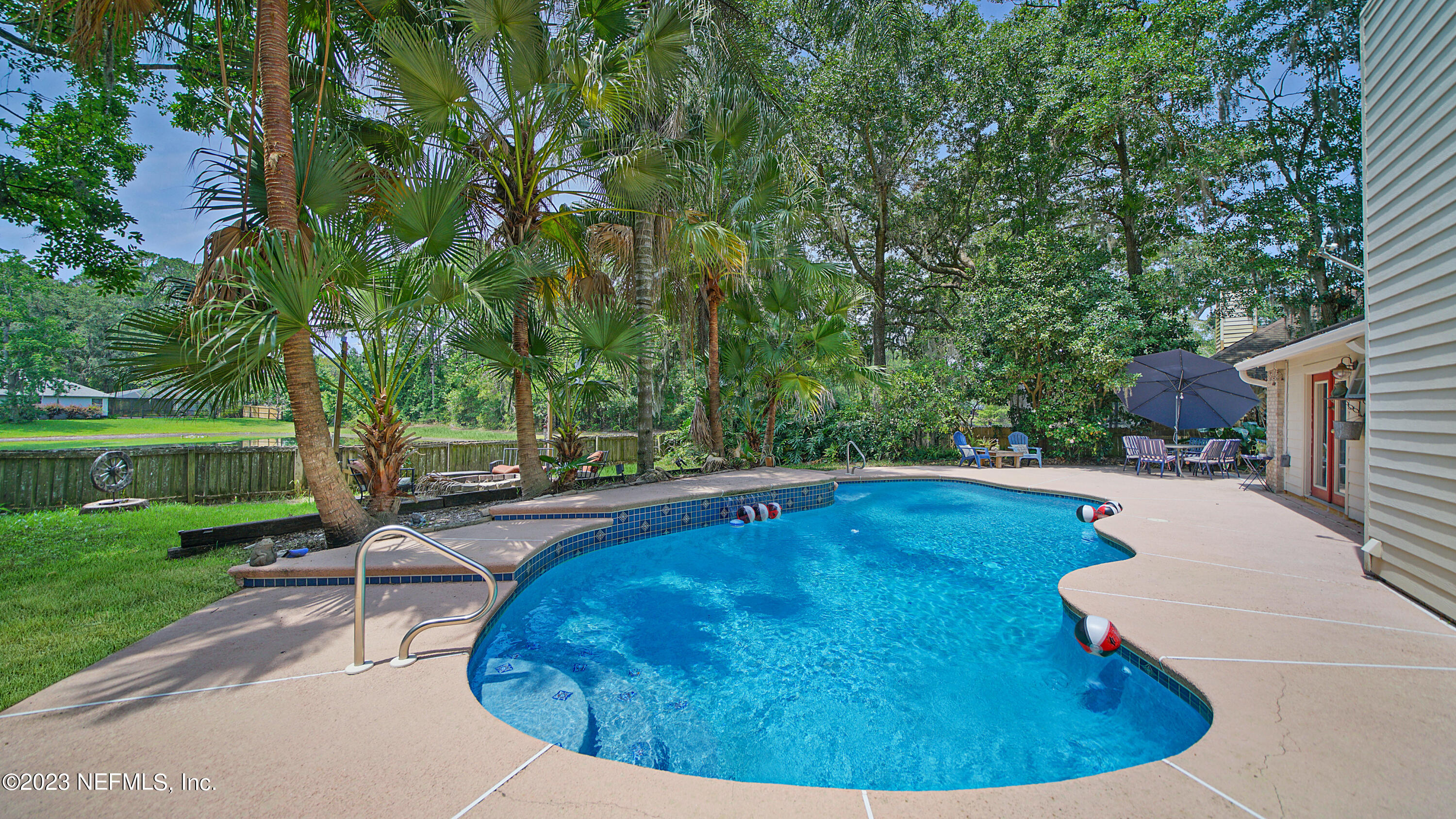 644 Hummingbird Court St. Johns, FL 32259 - Photo 2 of 36 a view of a swimming pool with a patio