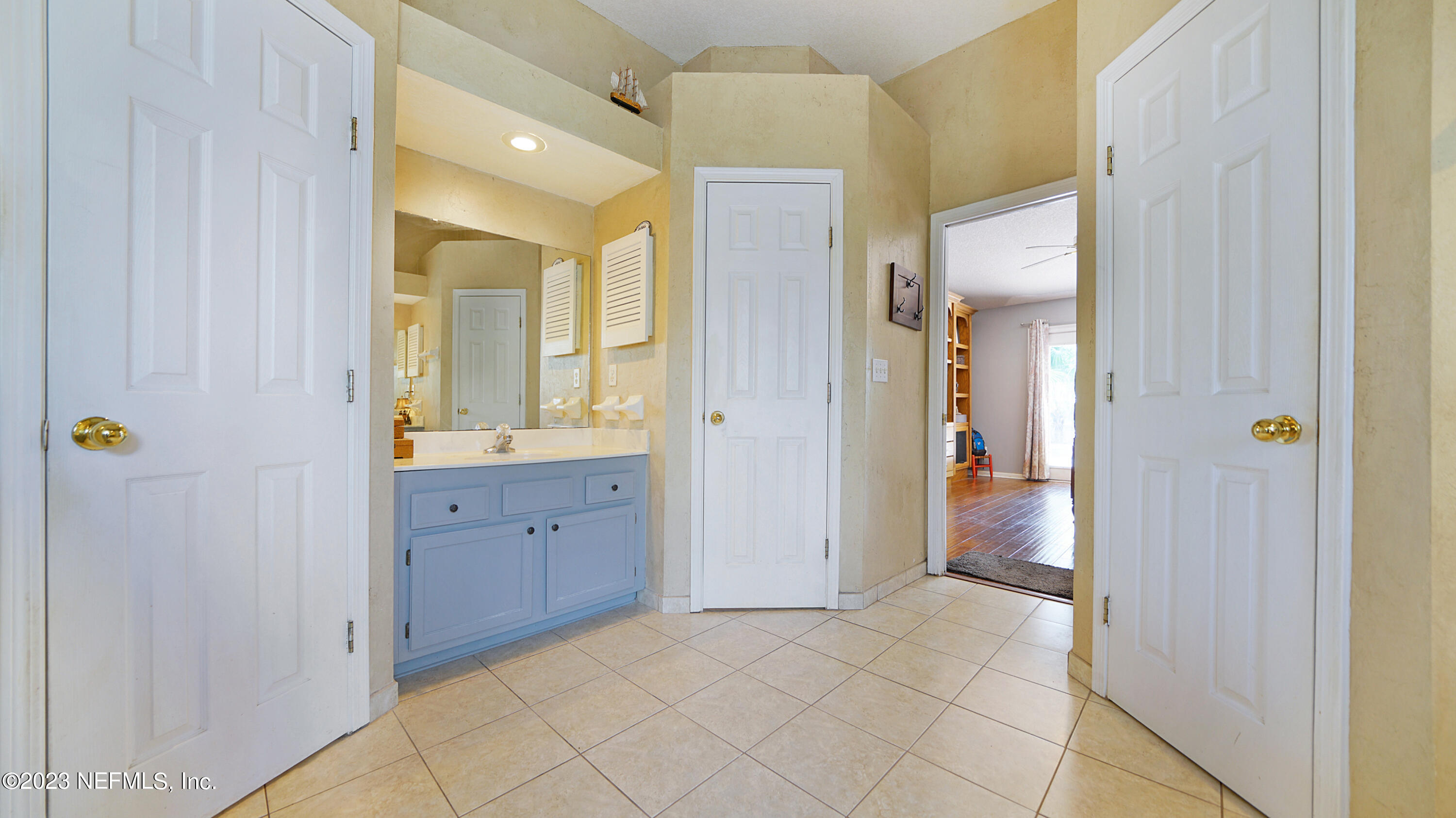 644 Hummingbird Court St. Johns, FL 32259 - Photo 24 of 36 a bathroom with a granite countertop sink mirror and shower