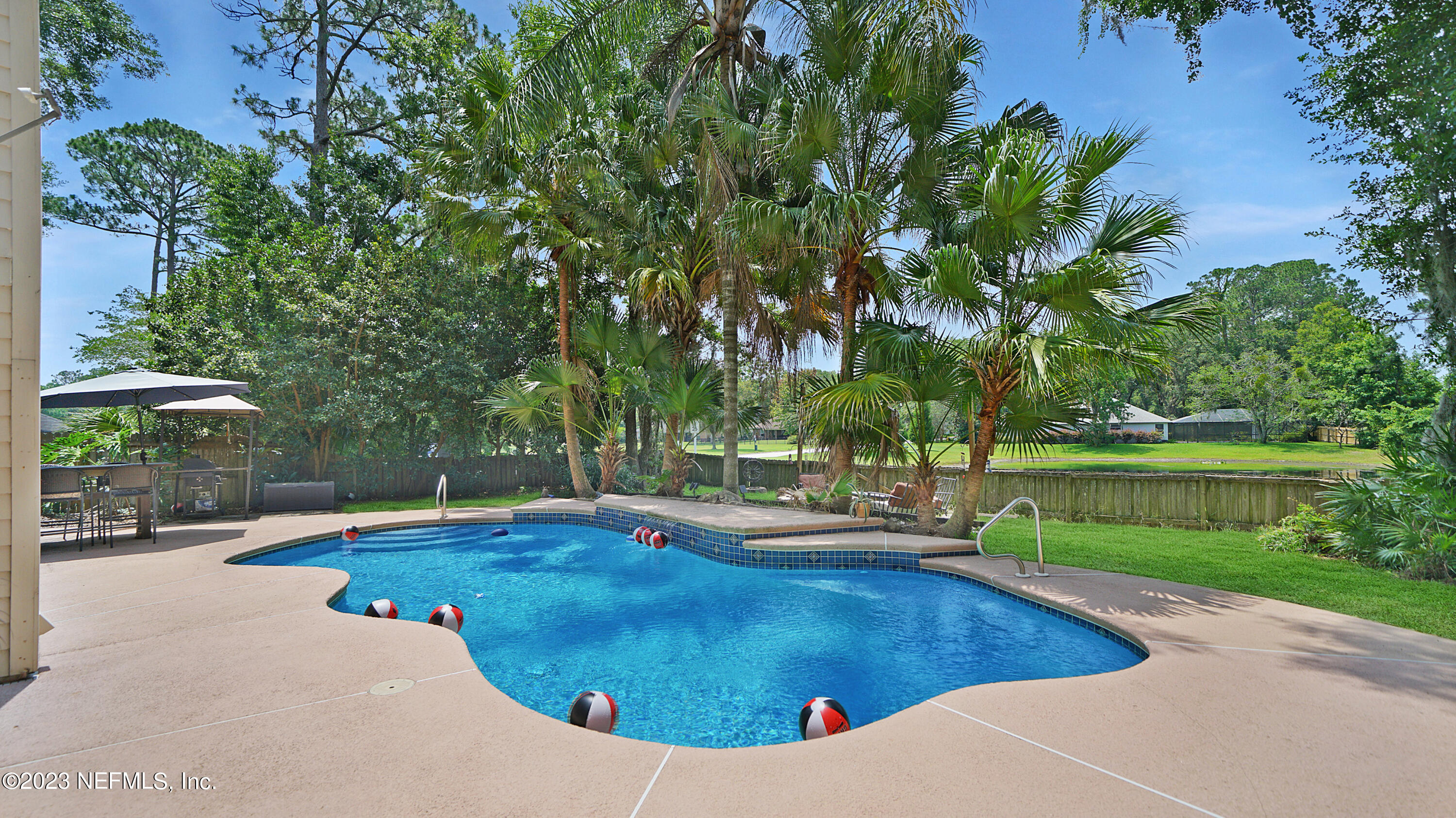 644 Hummingbird Court St. Johns, FL 32259 - Photo 27 of 36 a view of a swimming pool with a patio
