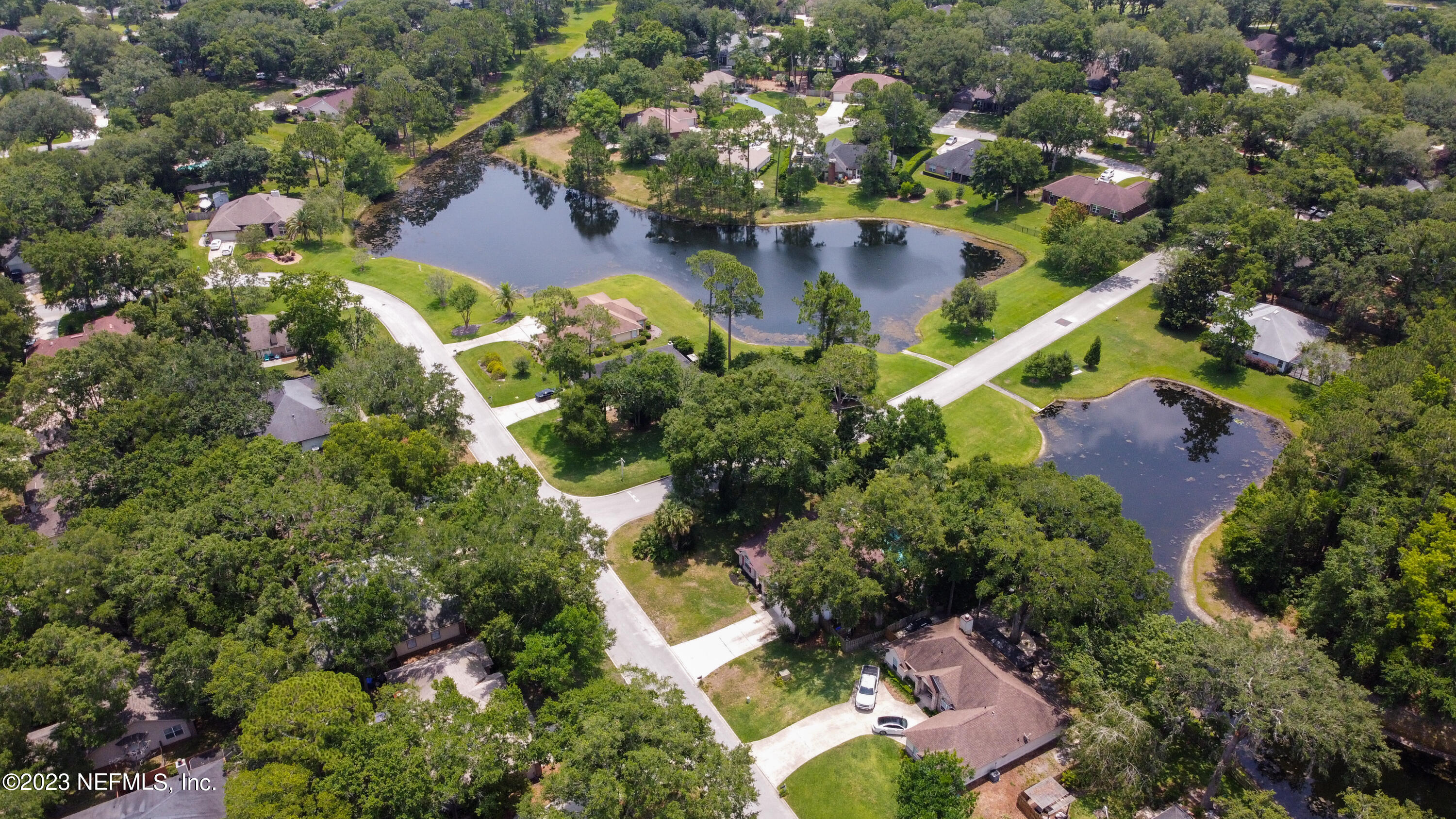644 Hummingbird Court St. Johns, FL 32259 - Photo 35 of 36 an aerial view of residential houses with outdoor space and trees
