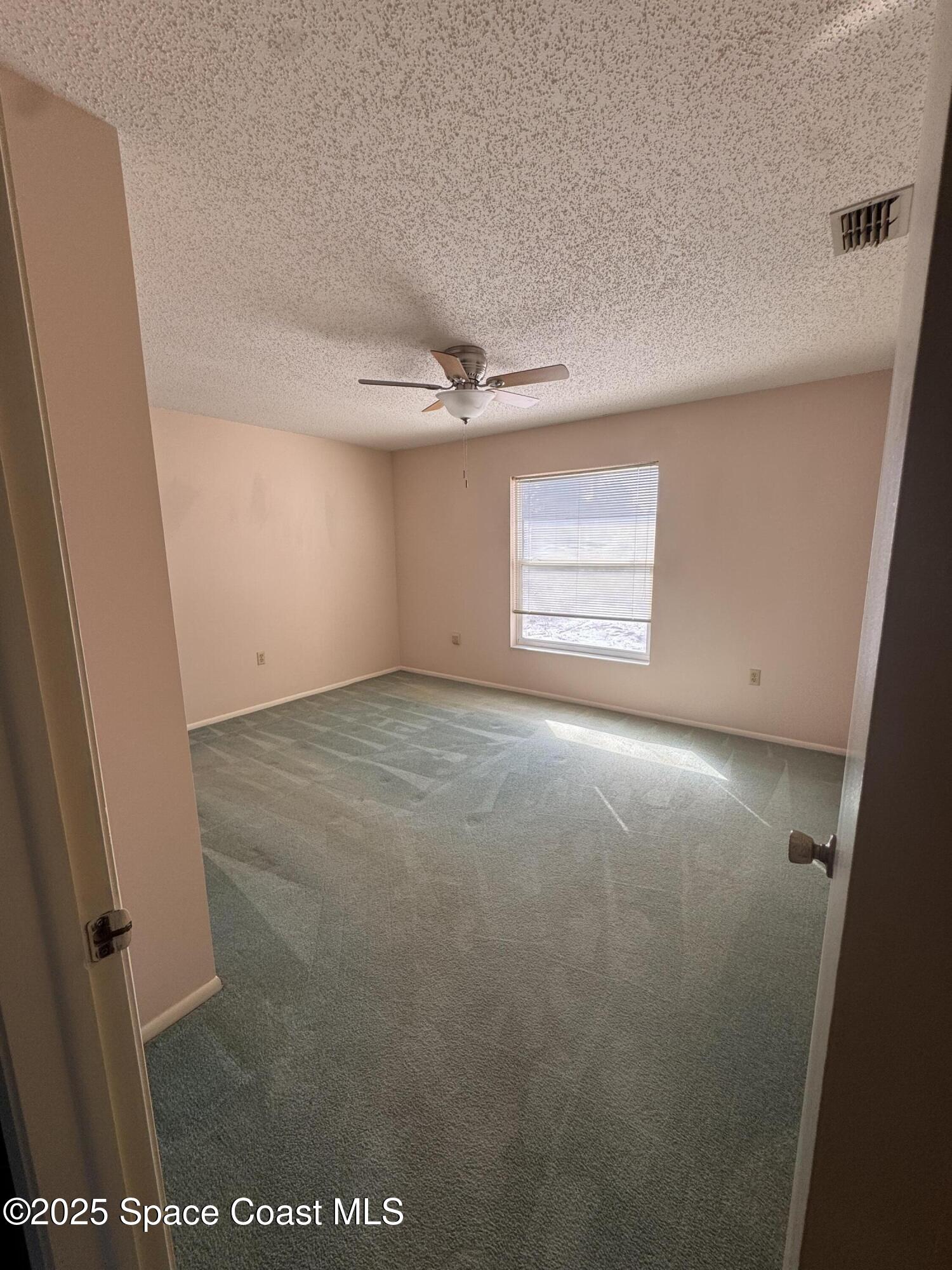 642 Altura Drive Cocoa, FL 32927 - Photo 4 of 13 an empty room with windows