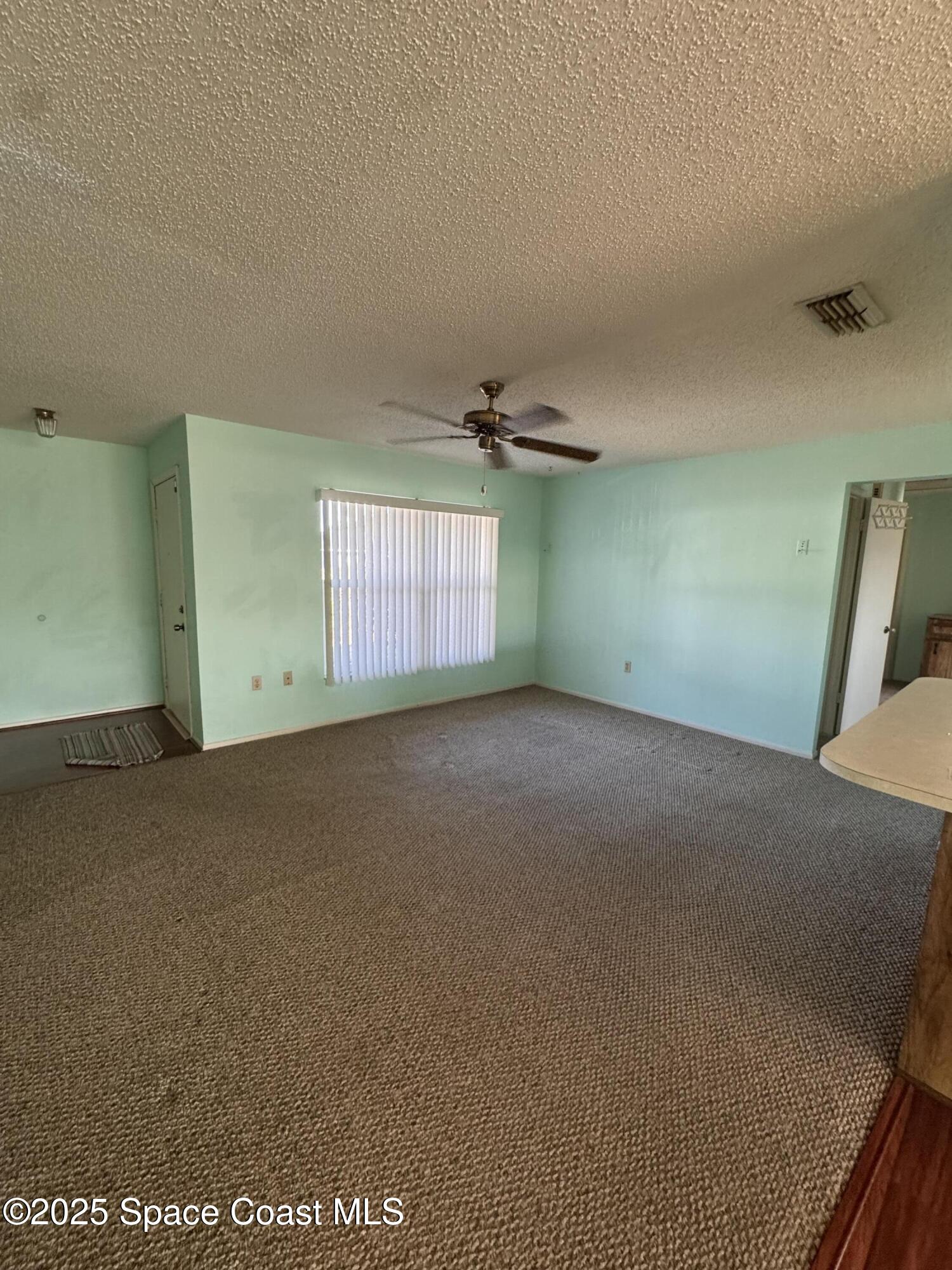 642 Altura Drive Cocoa, FL 32927 - Photo 6 of 13 an empty room with a empty space and windows