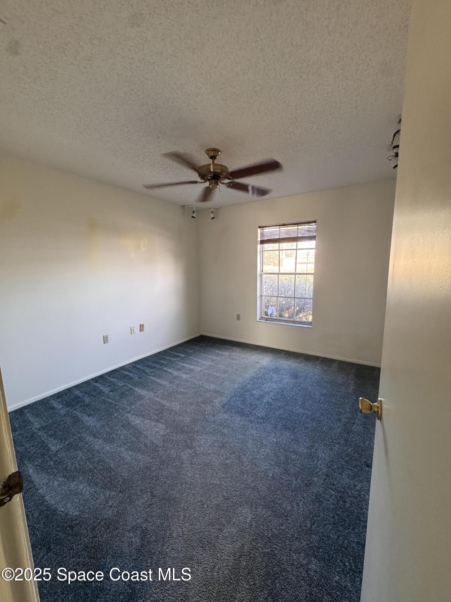 642 Altura Drive Cocoa, FL 32927 - Photo 7 of 13 a view of an empty room with a window