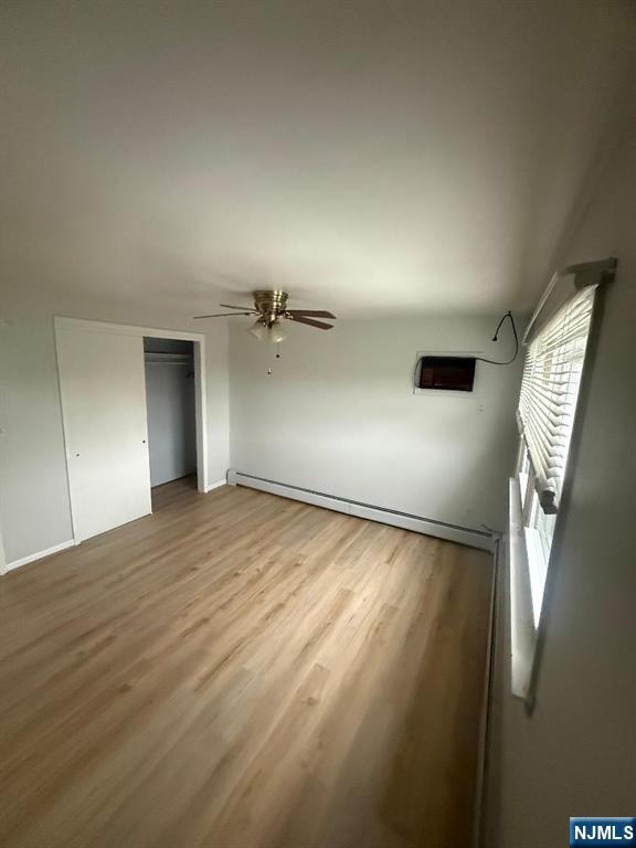 119 Garibaldi Avenue, Unit 2 Lodi, NJ 07644 - Photo 6 of 8 a view of empty room with wooden floor