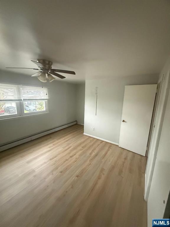 119 Garibaldi Avenue, Unit 2 Lodi, NJ 07644 - Photo 8 of 8 an empty room with a empty space and windows