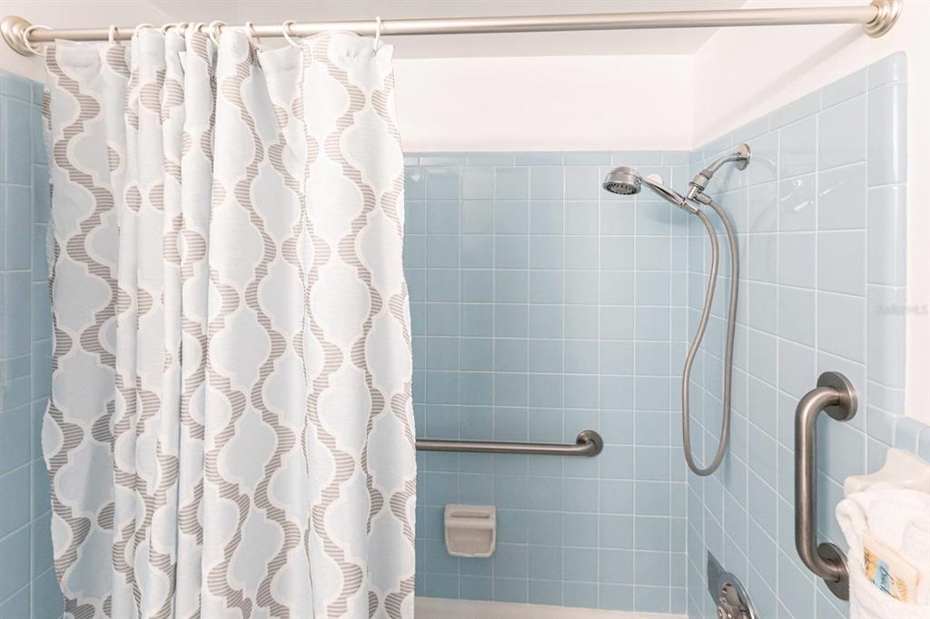 6006 Midnight Pass Road, Unit 5 Sarasota, FL 34242 - Photo 13 of 22 a bathroom with a shower