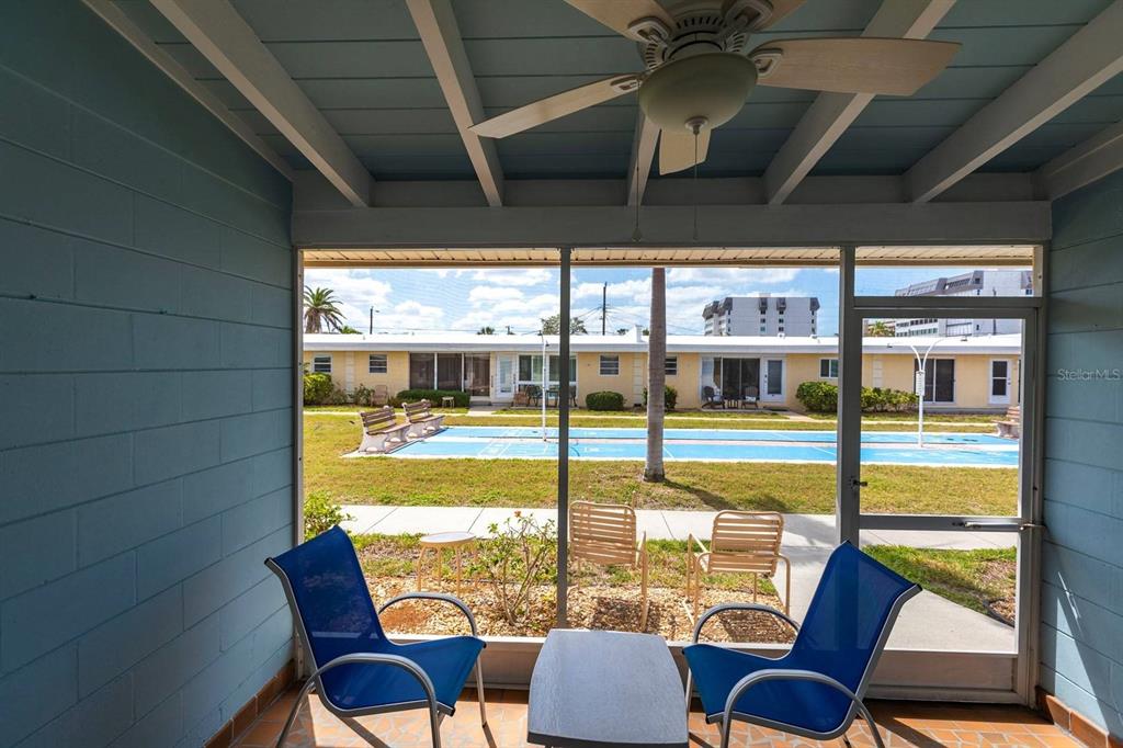 6006 Midnight Pass Road, Unit 5 Sarasota, FL 34242 - Photo 15 of 22 a view of a living room with furniture and floor to ceiling window