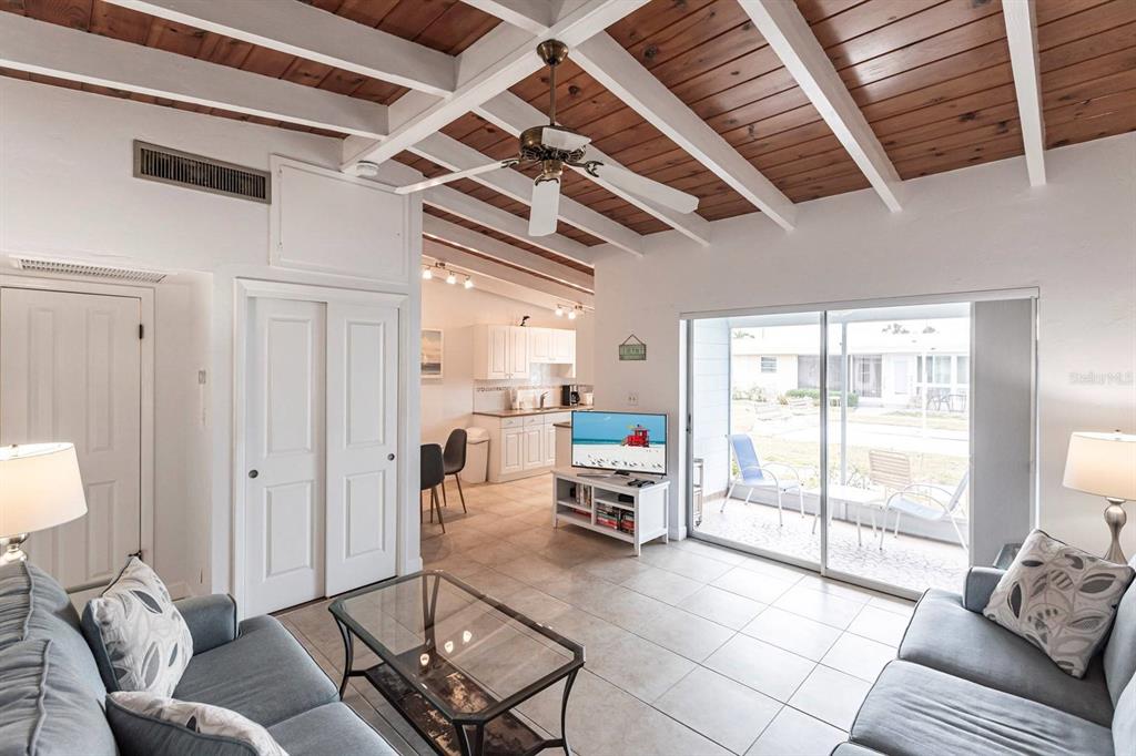 6006 Midnight Pass Road, Unit 5 Sarasota, FL 34242 - Photo 2 of 22 a living room with furniture and a large window