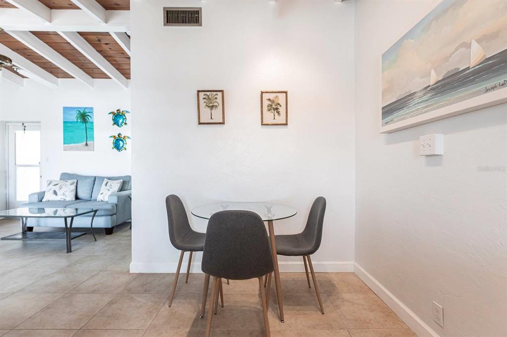6006 Midnight Pass Road, Unit 5 Sarasota, FL 34242 - Photo 8 of 22 a view of a livingroom with furniture and a window