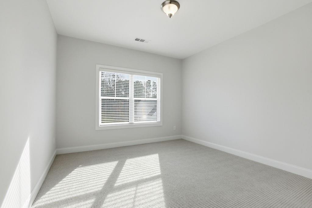 2865 Ferncliff Street Cumming, GA 30028 - Photo 21 of 41 an empty room with a window