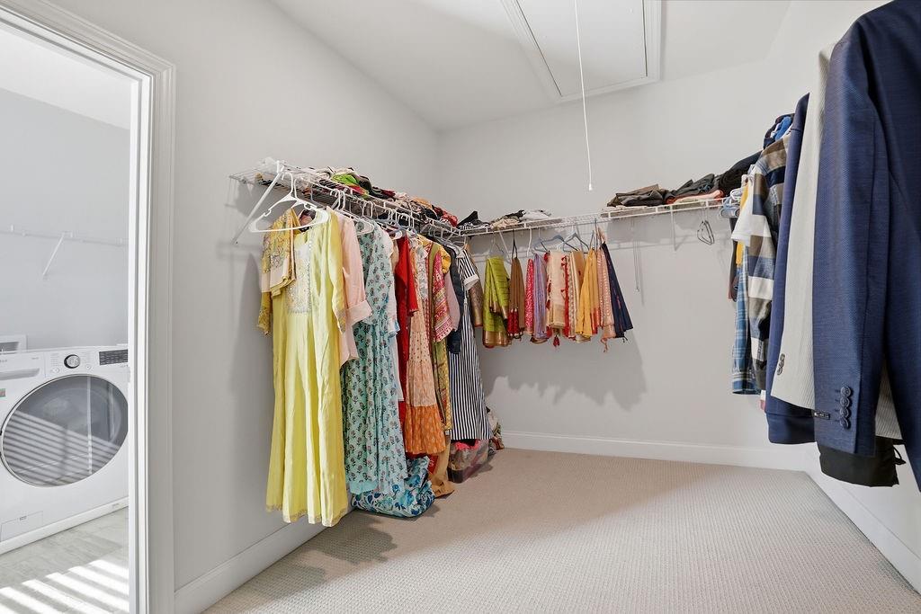 2865 Ferncliff Street Cumming, GA 30028 - Photo 27 of 41 a view of walk in closet with clothes