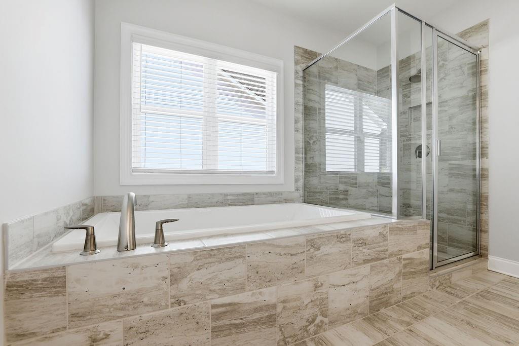 2865 Ferncliff Street Cumming, GA 30028 - Photo 32 of 41 a spacious bathroom with a bathtub and a shower