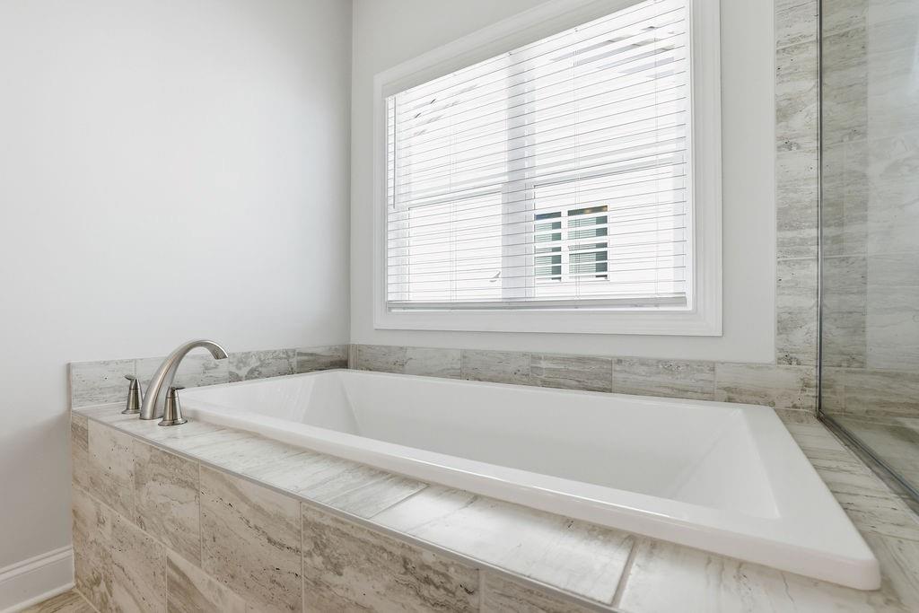2865 Ferncliff Street Cumming, GA 30028 - Photo 33 of 41 a white bath tub sitting next to a window
