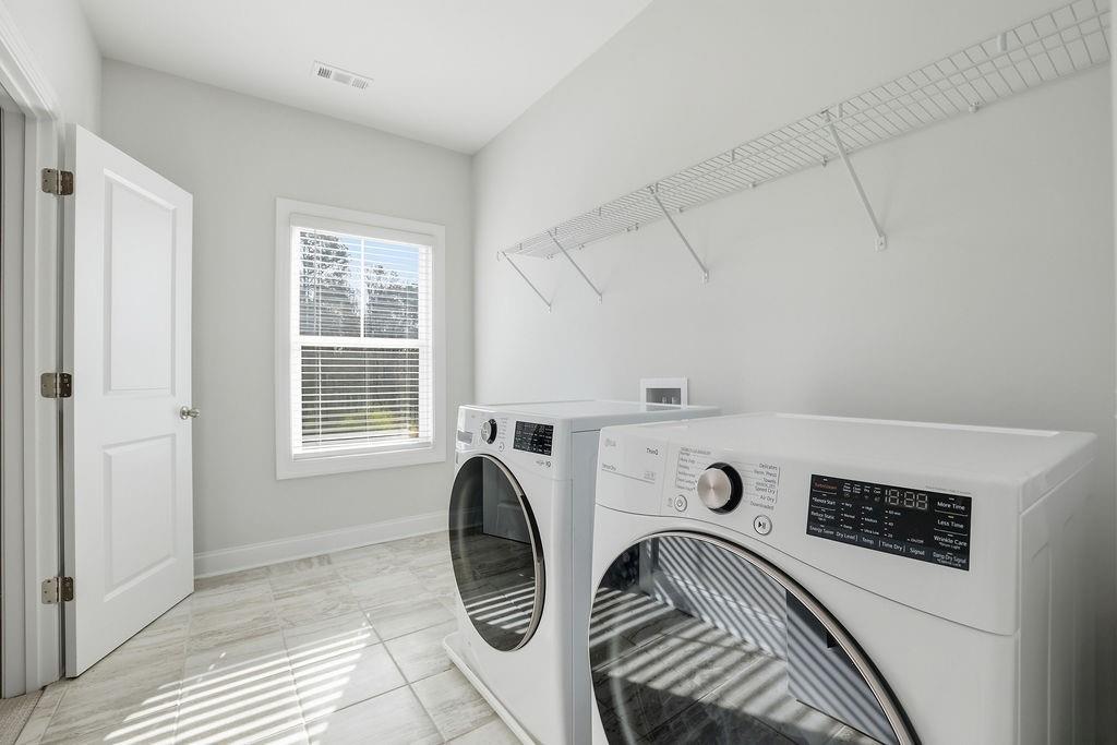 2865 Ferncliff Street Cumming, GA 30028 - Photo 34 of 41 a view of utility room with washer and dryer