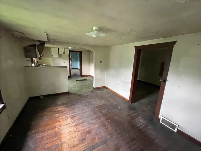 a view of a hallway with a chair