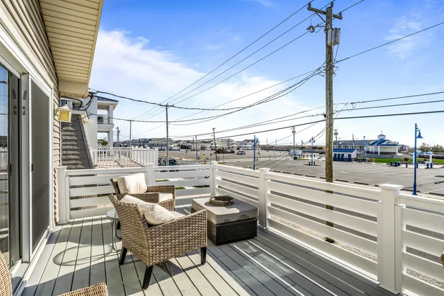 a bedroom with two beds and a window