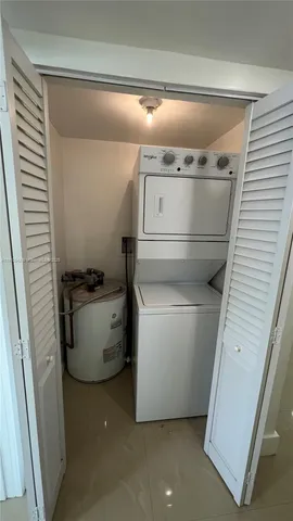 a view of a room with a white door