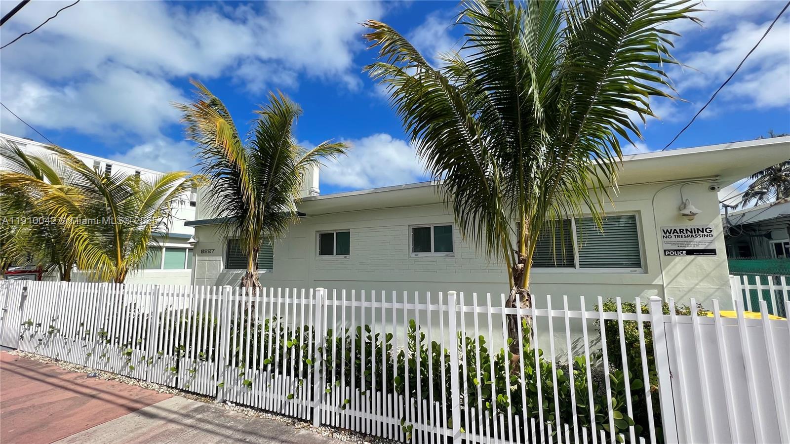 8235 Crespi Boulevard, Unit 1 Miami Beach, FL 33141 - Photo 19 of 24 a front view of house with yard and green space