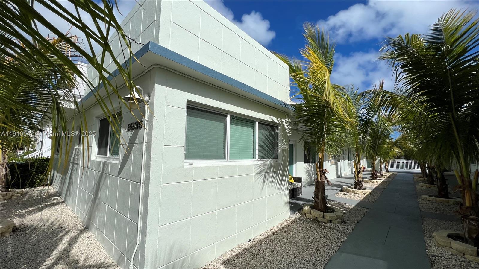 8235 Crespi Boulevard, Unit 1 Miami Beach, FL 33141 - Photo 23 of 24 a view of a house with a patio