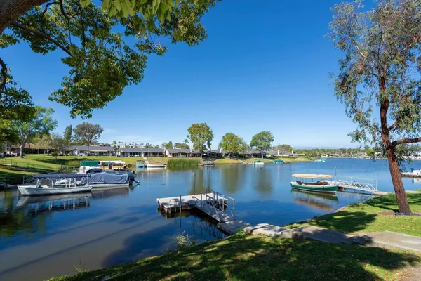 a view of a lake with houses with outdoor space