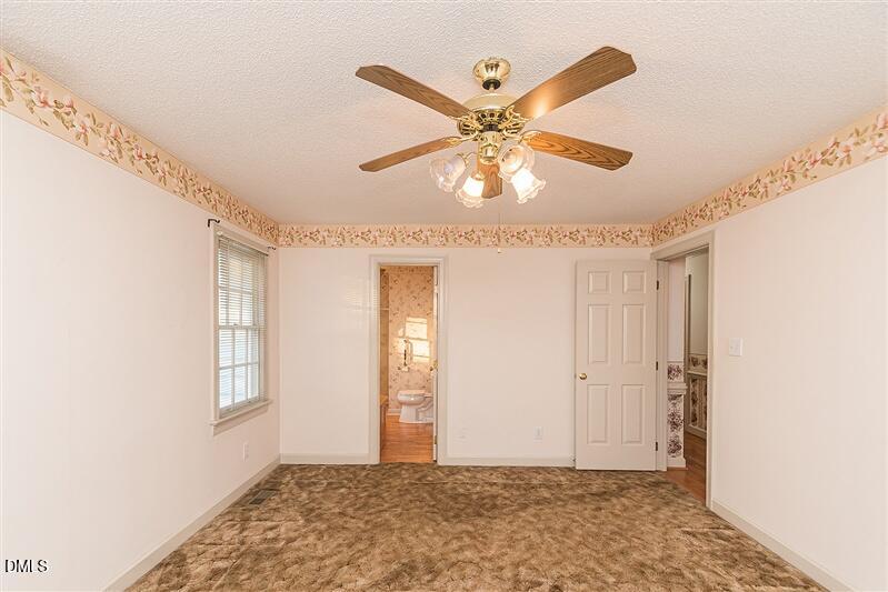 9908 Huntwyck Drive Raleigh, NC 27603 - Photo 11 of 32 a view of an empty room