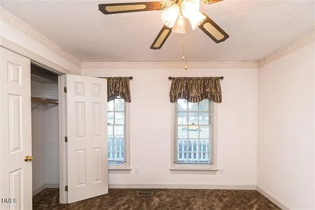 a view of an empty walk in closet