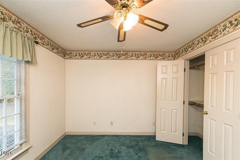 9908 Huntwyck Drive Raleigh, NC 27603 - Photo 18 of 32 a view of a garage