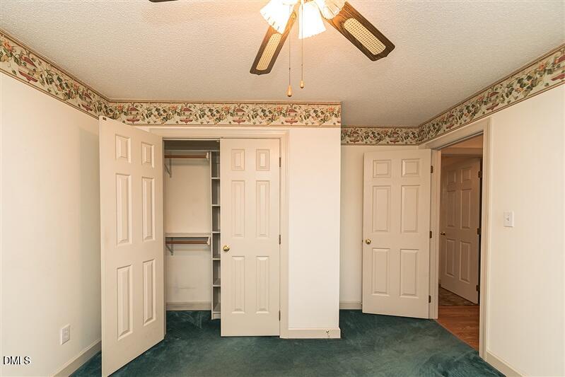 9908 Huntwyck Drive Raleigh, NC 27603 - Photo 19 of 32 a view of a hallway with elevator