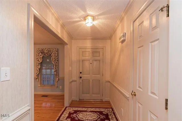 a room that has a rug and a window in it