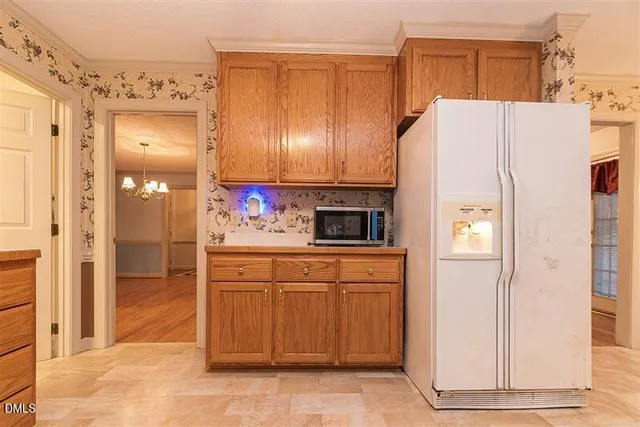 a kitchen with stainless steel appliances granite countertop a sink and a stove