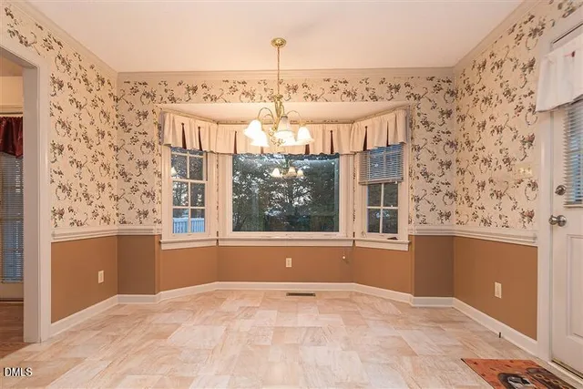 a kitchen with a refrigerator and a sink