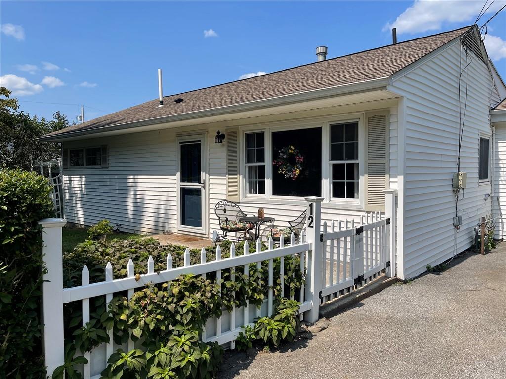 front view of a house with a small yard