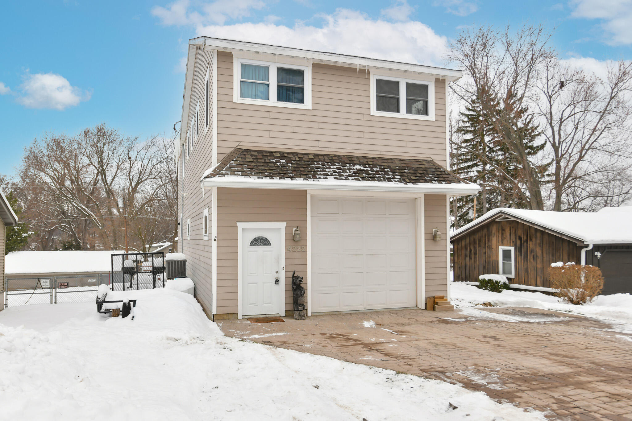 4222 Maple Drive Delavan, WI 53115 - Photo 35 of 44 Oversized garage with heated and epoxied flooring provides plenty of storage space for your prized watercraft.
