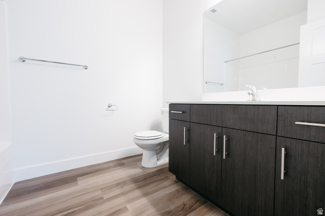 4653 South Alder Drive, Unit H303 Mapleton, UT 84664 - Photo 13 of 15 Bathroom with light wood finished floors and vanity