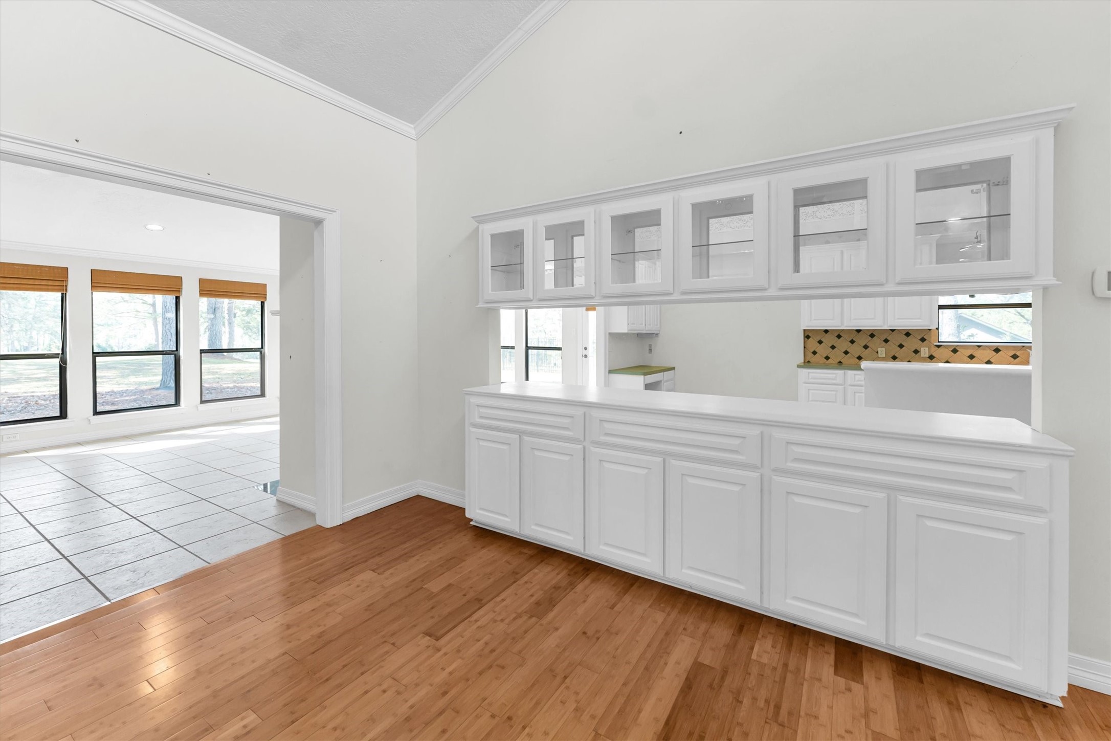 22509 Pebble Beach Way Point Blank, TX 77364 - Photo 11 of 50 a view of an empty room with wooden floor and a window