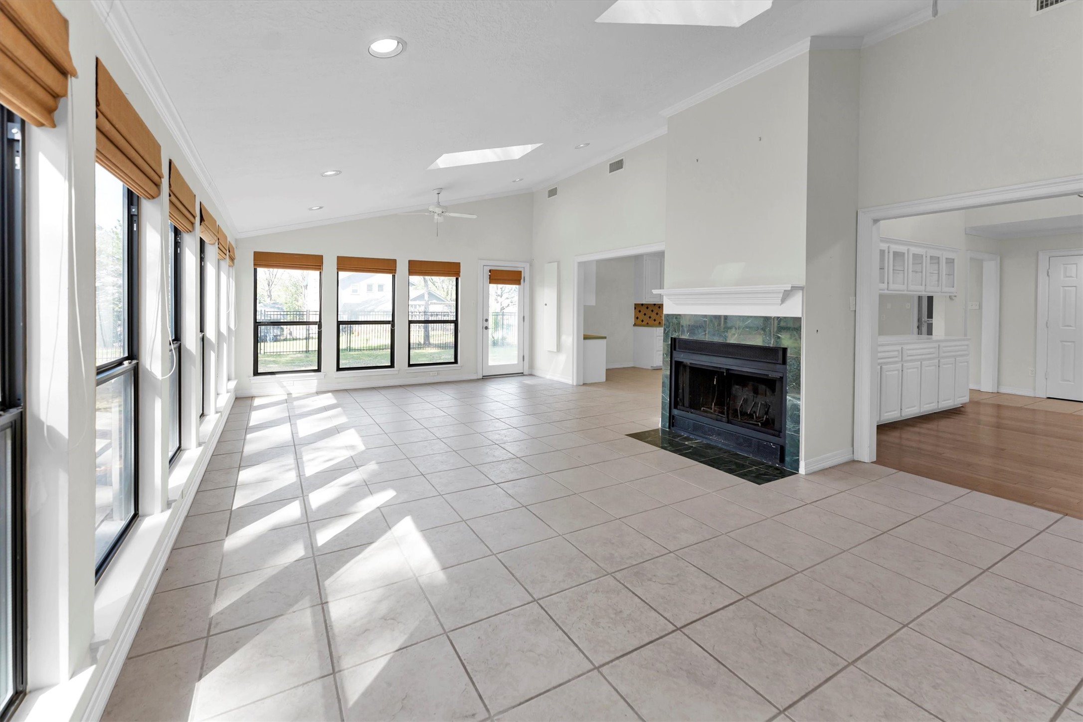 22509 Pebble Beach Way Point Blank, TX 77364 - Photo 14 of 50 a view of an empty room with a fireplace and a window