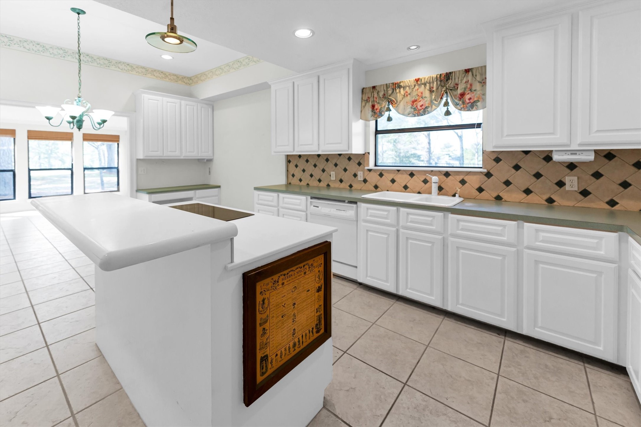 22509 Pebble Beach Way Point Blank, TX 77364 - Photo 24 of 50 a kitchen with granite countertop a sink window and cabinets