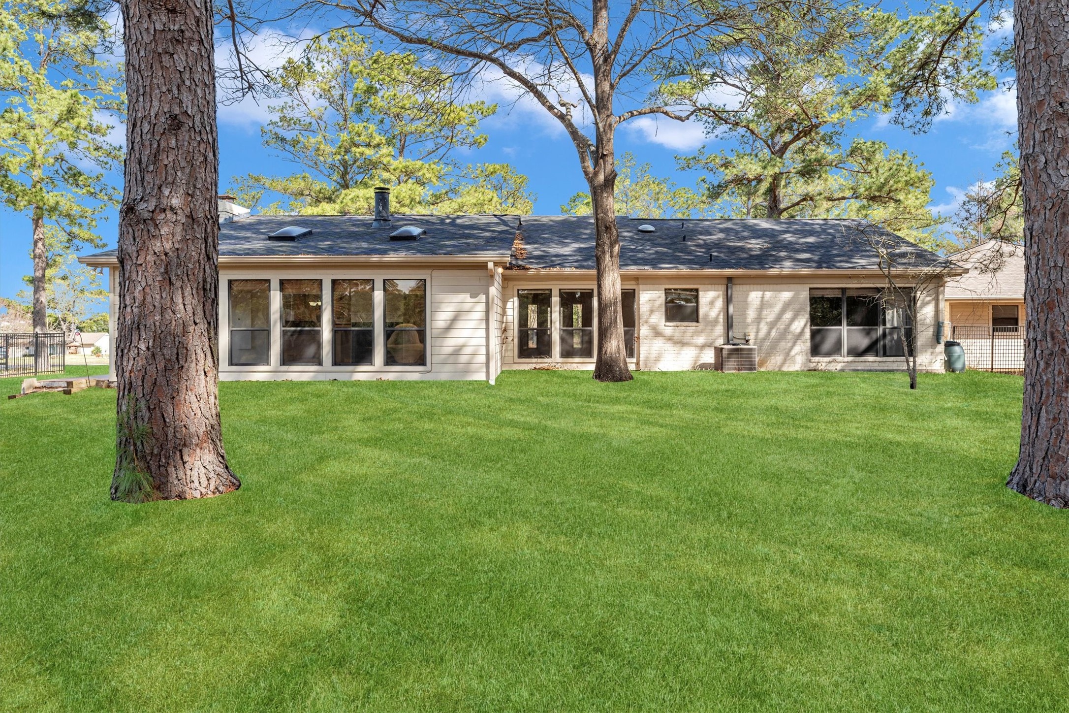 22509 Pebble Beach Way Point Blank, TX 77364 - Photo 36 of 50 a front view of a house with a garden