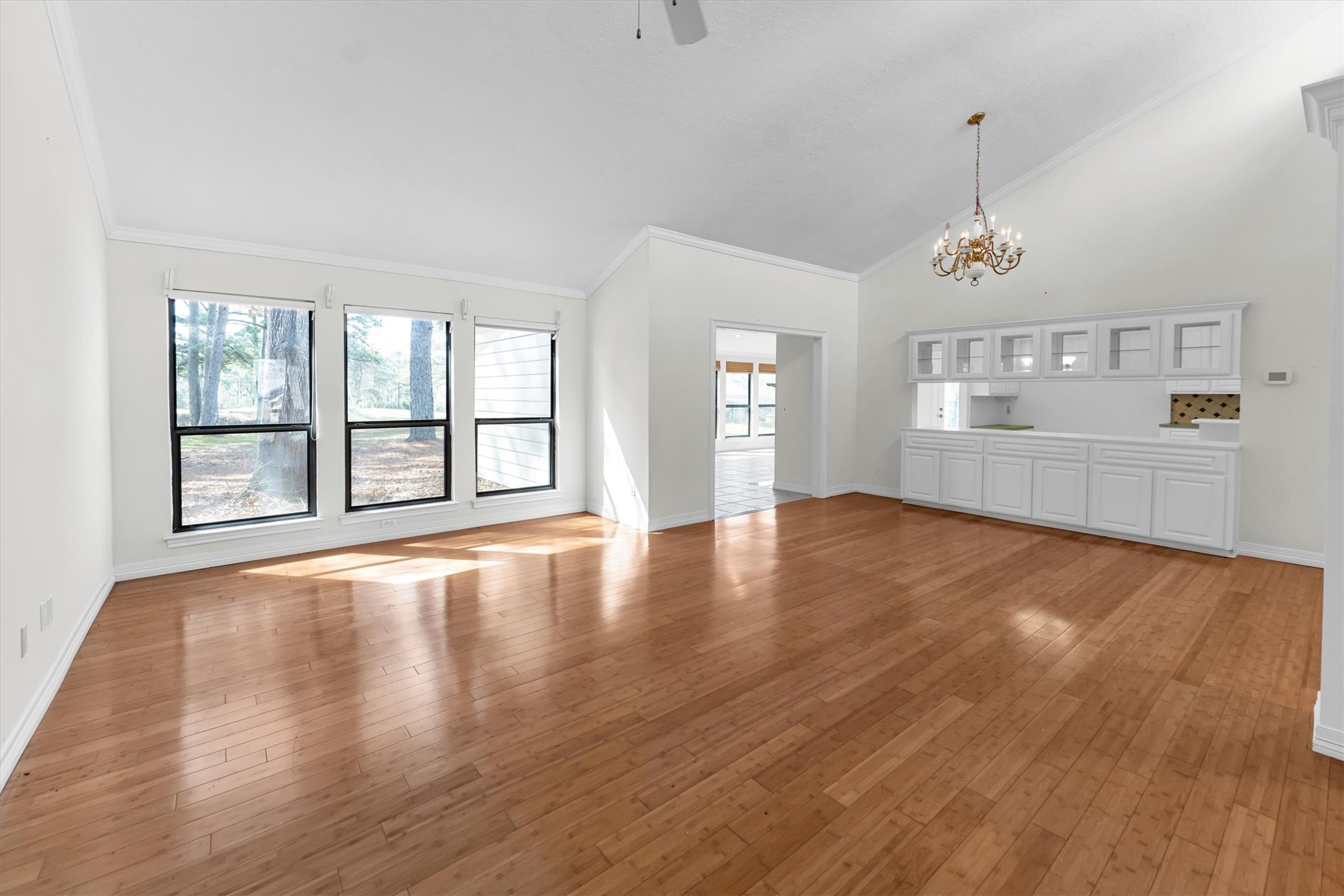 22509 Pebble Beach Way Point Blank, TX 77364 - Photo 6 of 50 an empty room with wooden floor and windows