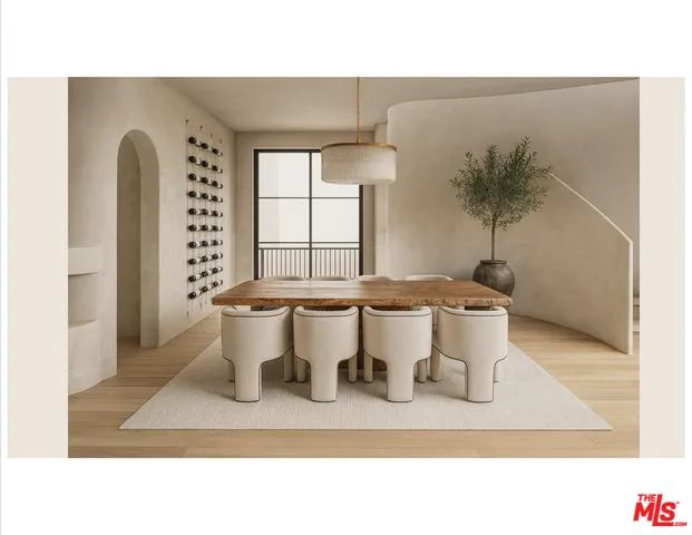 a living room with a couch and a potted plant