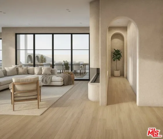 a living room with furniture and a floor to ceiling window