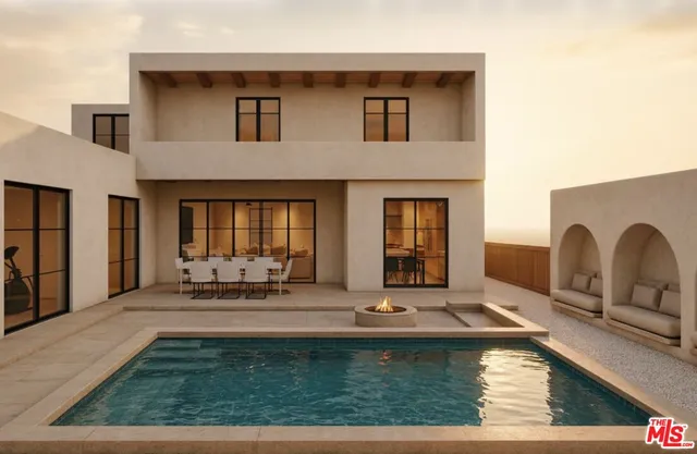 a view of a house with swimming pool and sitting area