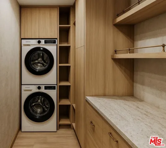 a utility room with sink dryer and washer