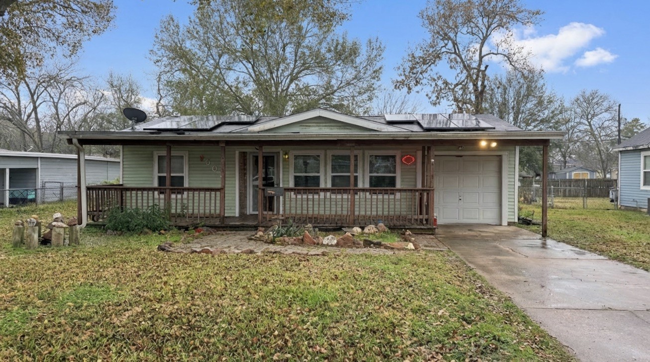 a front view of a house with yard and seating space