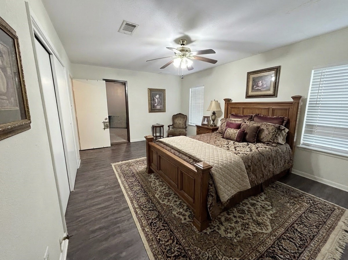503 Honeysuckle Drive La Marque, TX 77568 - Photo 13 of 24 a bedroom with a bed rug and wooden floor