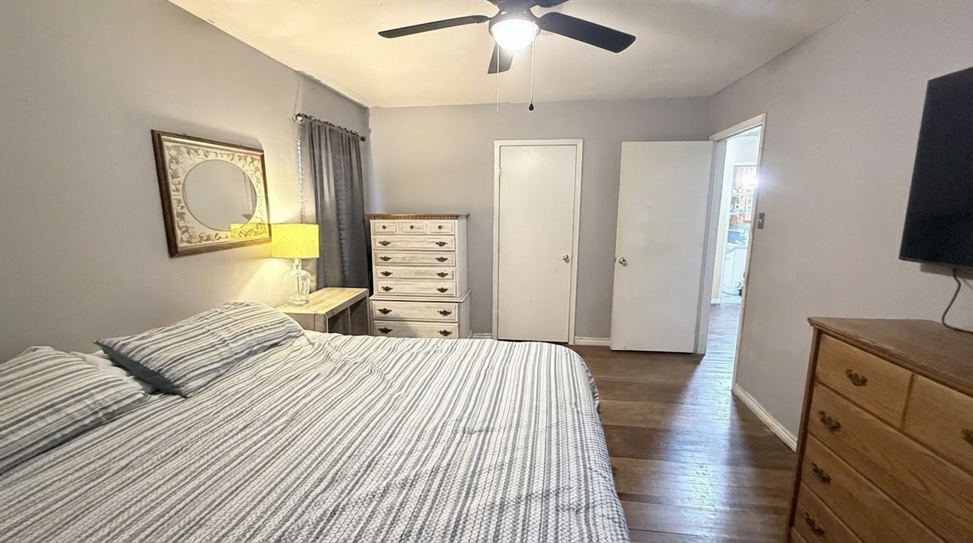 503 Honeysuckle Drive La Marque, TX 77568 - Photo 21 of 24 a bedroom with a bed and a flat screen tv